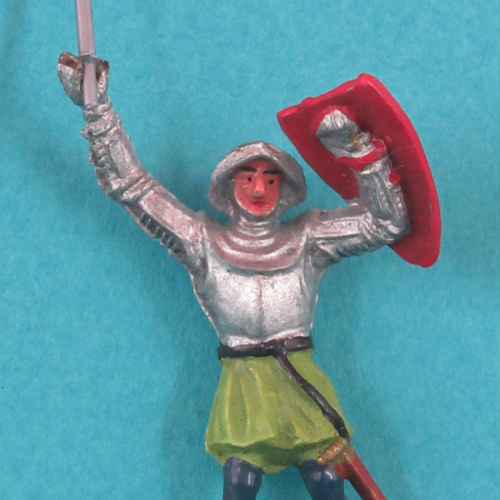 1210 Chevalier en armure, jambes parallèles, bras levés avec arme et écu (1222 avec socle).
