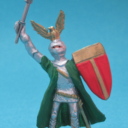 1215 Chevalier en armure, jambes parallèles, bras levés avec arme et bouclier, casque aigle et cape.
