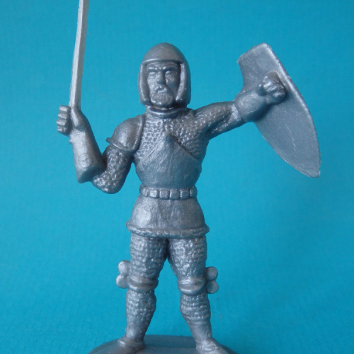 MAN/DOM 07. Chevalier de faction, épée et bouclier levés.