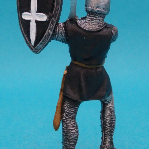 Soldat chrétien avec épée et bouclier levés.